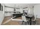 Kitchen area featuring an island and modern appliances, adjacent to the dining area at 35597 W Jones Ave, Tonopah, AZ 85354