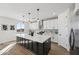 Bright kitchen featuring a large island with a white countertop and modern appliances at 35597 W Jones Ave, Tonopah, AZ 85354