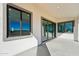 This covered patio shows the neutral wall color and expansive views of the surrounding area at 35597 W Jones Ave, Tonopah, AZ 85354