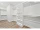 Walk-in closet featuring white shelving and ample storage space at 35597 W Jones Ave, Tonopah, AZ 85354