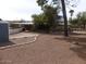 Expansive backyard featuring landscaping, shed, patio, and mature trees, great for outdoor activities at 409 S Mountain View Dr, Kearny, AZ 85137