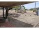 Backyard area, partially shaded, with some hardscape and block fencing at 409 S Mountain View Dr, Kearny, AZ 85137