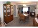 Inviting dining area complete with a wooden table and display cabinet at 409 S Mountain View Dr, Kearny, AZ 85137