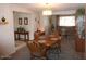 Inviting dining room features an elegant chandelier and traditional wooden table and chairs at 409 S Mountain View Dr, Kearny, AZ 85137