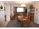 Comfortable dining room boasts an elegant chandelier and classic wood table at 409 S Mountain View Dr, Kearny, AZ 85137