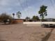 A long shot of a back yard on a sunny day at 409 S Mountain View Dr, Kearny, AZ 85137