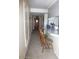 Hallway view featuring the front door and views of a kitchen counter with wooden stools at 409 S Mountain View Dr, Kearny, AZ 85137