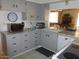 Traditional-style kitchen featuring neutral cabinets, modern appliances, and granite countertops at 409 S Mountain View Dr, Kearny, AZ 85137