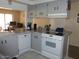 Functional kitchen featuring neutral cabinetry, granite countertops, and modern appliances at 409 S Mountain View Dr, Kearny, AZ 85137