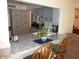 A bright kitchen with granite countertops and wood chairs in a cozy, neutral color scheme at 409 S Mountain View Dr, Kearny, AZ 85137