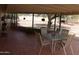 Covered patio featuring a brick floor and outdoor seating area at 409 S Mountain View Dr, Kearny, AZ 85137