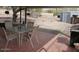 Covered patio with red brick floor, table and chairs overlooking the backyard at 409 S Mountain View Dr, Kearny, AZ 85137