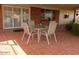 Red brick covered patio with table and chairs at 409 S Mountain View Dr, Kearny, AZ 85137