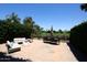 An inviting back patio set against a backdrop of lush greenery and a well-manicured golf course at 4621 N 65Th St # 152, Scottsdale, AZ 85251