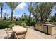 Outdoor dining area with a built-in kitchen and BBQ, perfect for alfresco dining and entertaining at 4621 N 65Th St # 152, Scottsdale, AZ 85251