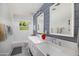 Charming bathroom featuring a double sink vanity and a shower-tub combo at 4826 N 34Th Pl, Phoenix, AZ 85018