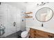 Bathroom featuring marble herringbone tile shower and wood cabinet vanity at 4826 N 34Th Pl, Phoenix, AZ 85018