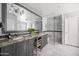 Elegant bathroom featuring double sinks, a glass-enclosed shower, and nice tile work at 4826 N 34Th Pl, Phoenix, AZ 85018