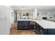 Stylish kitchen island with a wine fridge, ample storage, and sleek countertops at 4826 N 34Th Pl, Phoenix, AZ 85018