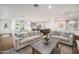 Open living room featuring hardwood floors and a seamless transition to the spacious kitchen at 4826 N 34Th Pl, Phoenix, AZ 85018