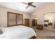 Bedroom featuring a large window, wood dresser and mirrored closet, providing great natural light and storage at 500 N Roosevelt Ave # 118, Chandler, AZ 85226