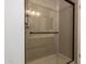 Shower with clear glass door and stone surround at 500 N Roosevelt Ave # 118, Chandler, AZ 85226