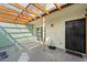 Back patio including a translucent roof, concrete floor, and security gate at 5106 N 17Th Ave # 11, Phoenix, AZ 85015