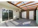 Back patio featuring a covered roof, dual garage doors, and sliding glass door at 5106 N 17Th Ave # 11, Phoenix, AZ 85015