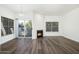 Inviting living room featuring wood floors, fireplace, and sliding glass doors to the balcony at 600 W Grove Pkwy # 2188, Tempe, AZ 85283