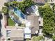 Aerial view of the estate showcasing a pool, lush greenery, and multiple red-tiled roof structures at 6221 E Vista Dr, Paradise Valley, AZ 85253