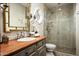 Elegant bathroom with a walk-in shower, intricate mirror, and unique vanity, creating a luxurious and inviting space at 6221 E Vista Dr, Paradise Valley, AZ 85253