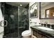 Bathroom featuring a stunning green marble shower with a glass door and a vanity with matching green marble countertop at 6221 E Vista Dr, Paradise Valley, AZ 85253