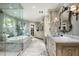 Luxurious bathroom featuring a soaking tub, marble counters, and stylish fixtures at 6221 E Vista Dr, Paradise Valley, AZ 85253