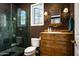 This bathroom features a spacious tiled shower, a classic wooden vanity, and a window providing natural light at 6221 E Vista Dr, Paradise Valley, AZ 85253