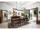 Elegant dining room with chandelier and view of the outdoor living space at 6221 E Vista Dr, Paradise Valley, AZ 85253