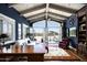 Sophisticated living room with wood beamed ceilings, hardwood floors and access to the patio at 6221 E Vista Dr, Paradise Valley, AZ 85253