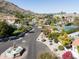 Picturesque street view with desert landscaping, mountain views, neighborhood fountain, and tennis court at 6221 E Vista Dr, Paradise Valley, AZ 85253