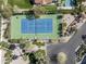 An aerial view of a tennis court, swimming pool, and lush, mature desert landscaping at 6221 E Vista Dr, Paradise Valley, AZ 85253