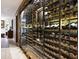 Temperature-controlled wine cellar showcases an extensive collection behind glass doors, blending functionality with sophistication at 6221 E Vista Dr, Paradise Valley, AZ 85253