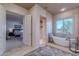 Elegant bathroom with a freestanding tub, separate shower, and view from the window at 7442 E Golden Eagle Cir, Gold Canyon, AZ 85118