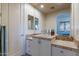 Bathroom with a single sink vanity, tiled counter, and views of the bedroom at 7442 E Golden Eagle Cir, Gold Canyon, AZ 85118