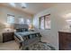 Bedroom with a queen bed, side tables with lamps, and a decorative blue rug at 7442 E Golden Eagle Cir, Gold Canyon, AZ 85118