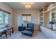 Cozy bedroom with natural light, built-in shelving, and a comfortable chair, creating a relaxing space at 7442 E Golden Eagle Cir, Gold Canyon, AZ 85118