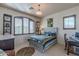 Bright bedroom with a large window, desk, and display shelf at 7442 E Golden Eagle Cir, Gold Canyon, AZ 85118