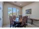 Cozy dining area with a round table, large window, and stylish decor at 7442 E Golden Eagle Cir, Gold Canyon, AZ 85118