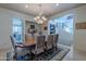 Bright dining room showcases the chandelier, stairway and open layout, perfect for entertaining guests at 7442 E Golden Eagle Cir, Gold Canyon, AZ 85118