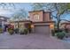 Charming home with a stone accent wall, desert landscaping, and a two-car garage at 7442 E Golden Eagle Cir, Gold Canyon, AZ 85118