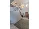 Elegant foyer with staircase, chandelier, and marble flooring at 7442 E Golden Eagle Cir, Gold Canyon, AZ 85118