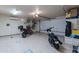 Spacious garage with epoxy floors and plenty of room for motorbikes and storage at 7442 E Golden Eagle Cir, Gold Canyon, AZ 85118