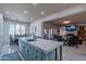 Bright, open kitchen with a large island, modern appliances, and views into the living room at 7442 E Golden Eagle Cir, Gold Canyon, AZ 85118